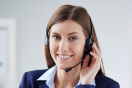 Young businesswoman with headset working in office